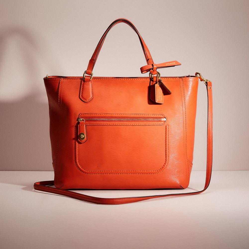 Coach orange store tote bag