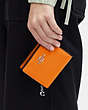 COACH®,SNAP WALLET WITH SIGNATURE CANVAS INTERIOR,Leather,Mini,Silver/Bright Mandarin,Detail View