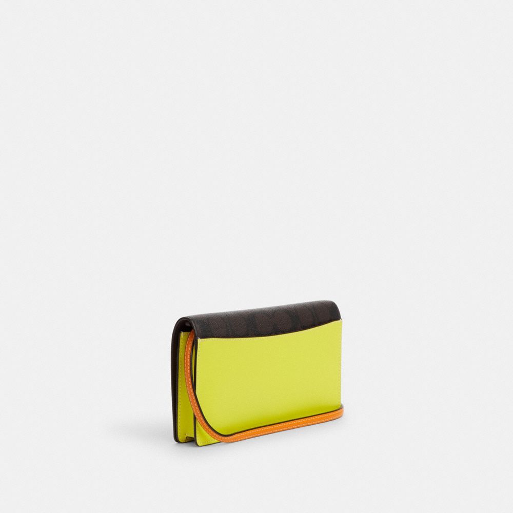COACH®,Anna Foldover Clutch Crossbody In Colorblock Signature Canvas,,Angle View