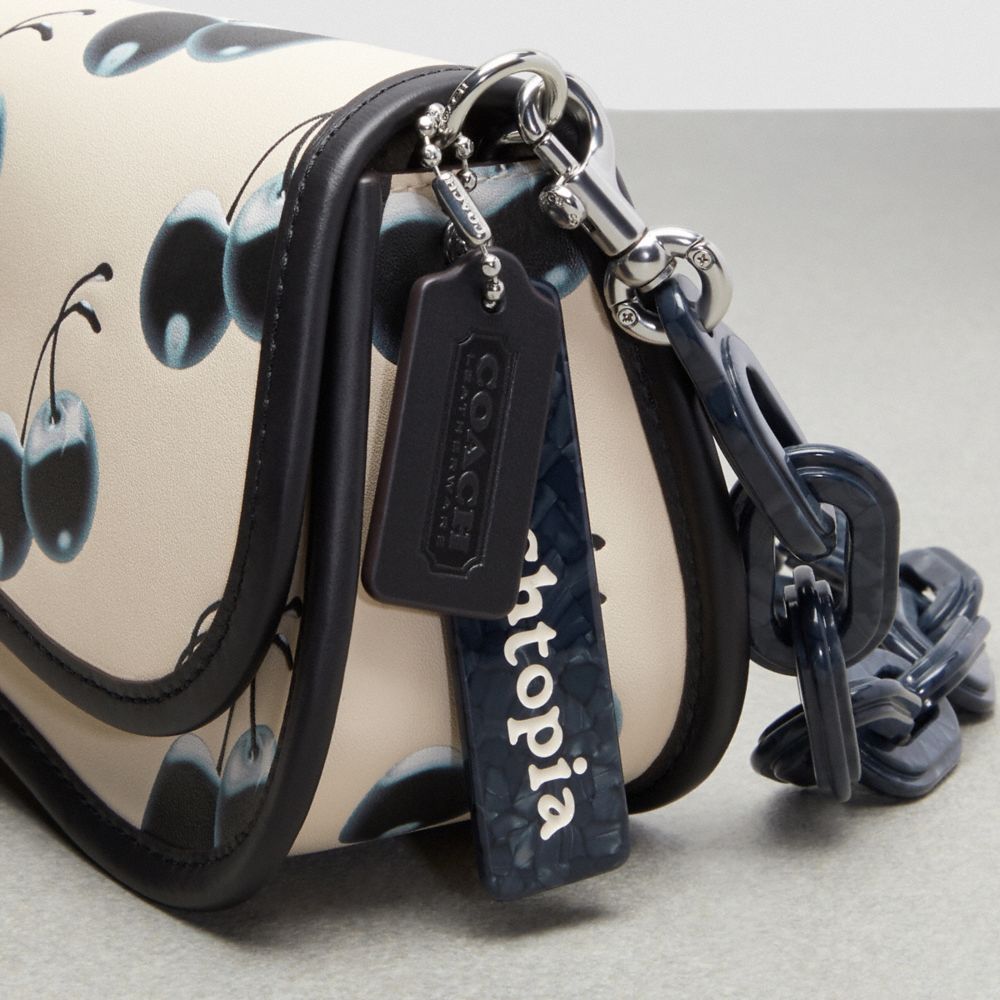 Coach Wavy Dinky Bag In Topia Leather With Cherry Print In Black/chalk Multi