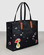 COACH®,Tote in 100% Recycled Canvas: This is Coachtopia,Large,Black,Angle View