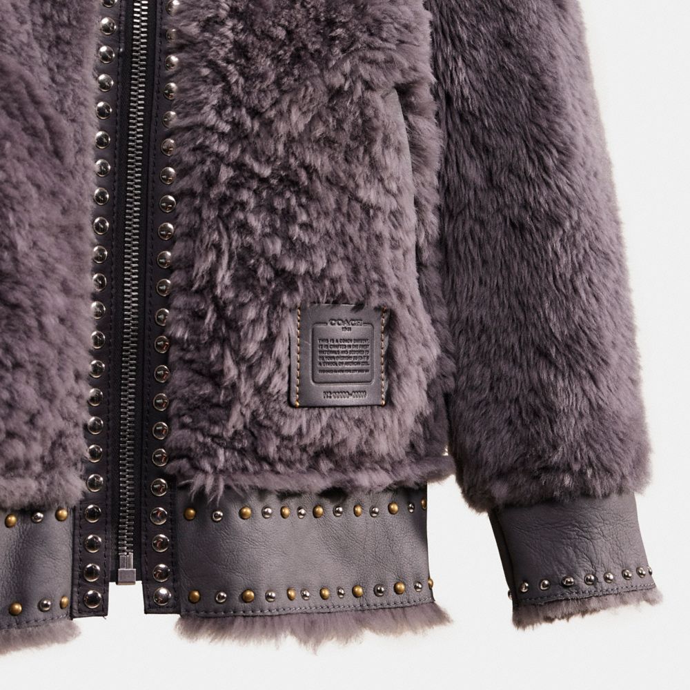 COACH®: Reversible Shearling Hoodie