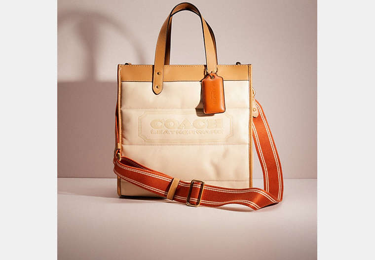 COACH®,RESTORED FIELD TOTE WITH COLORBLOCK QUILTING AND COACH BADGE,Signature Coated Canvas/Leather,Mini,Brass/Ivory Multi,Front View