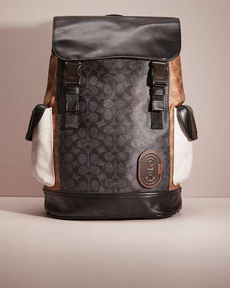 COACH®,RESTORED RIVINGTON BACKPACK IN COLORBLOCK SIGNATURE CANVAS,Polished Pebble Leather,Medium,Black Copper/Charcoal Multi,Front View