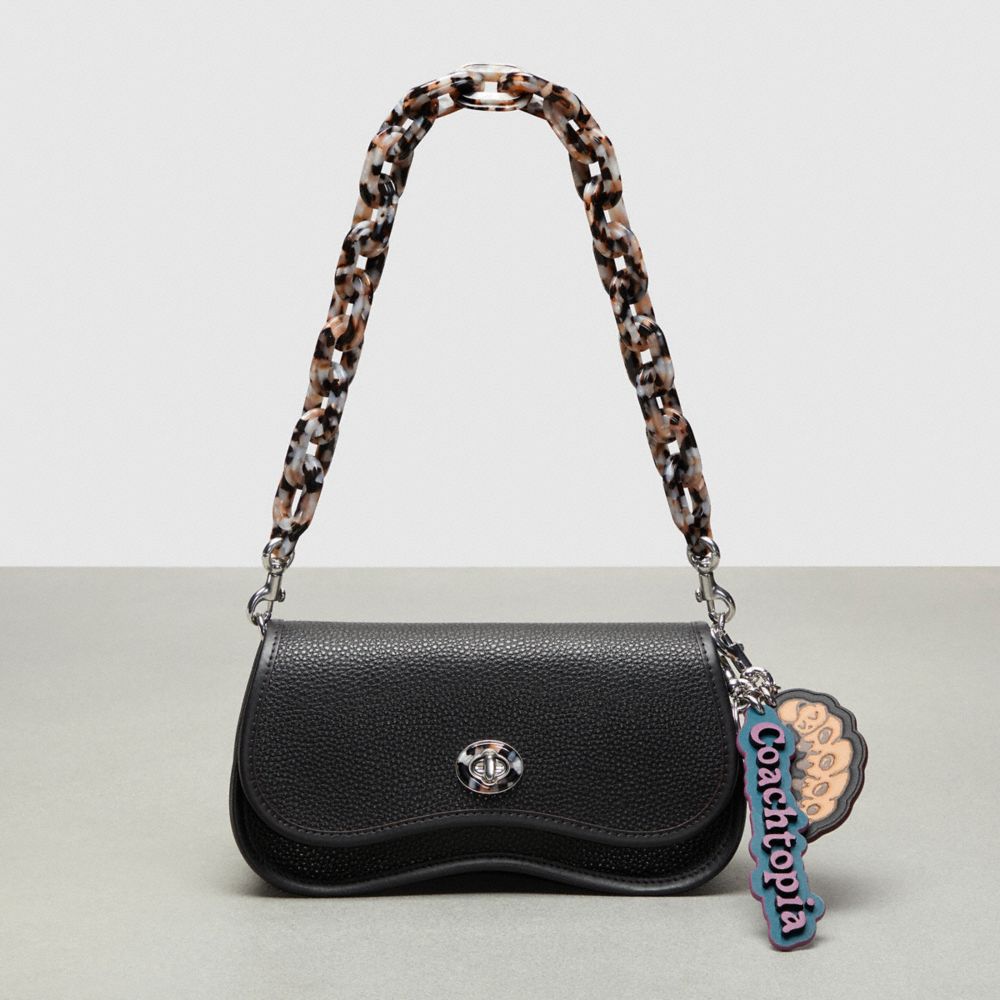 COACH®,Coachtopia Bag Charm In Coachtopia Leather,Coachtopia Leather,Lilac Berry,Angle View