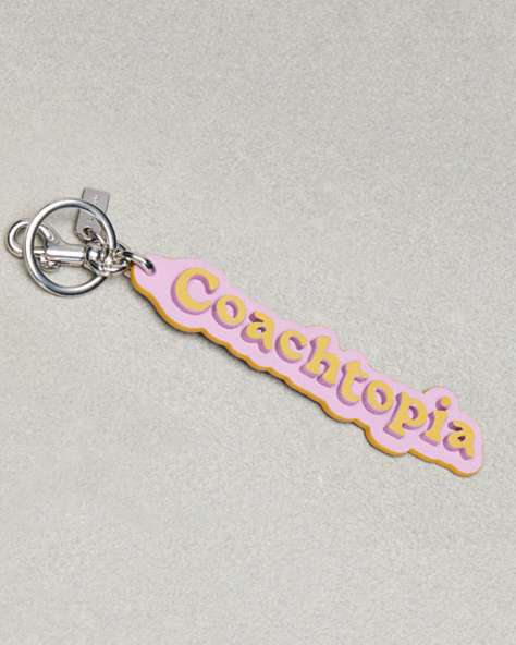 COACH®,Coachtopia Bag Charm In Coachtopia Leather,Coachtopia Leather,Violet Orchid/Flax,Front View
