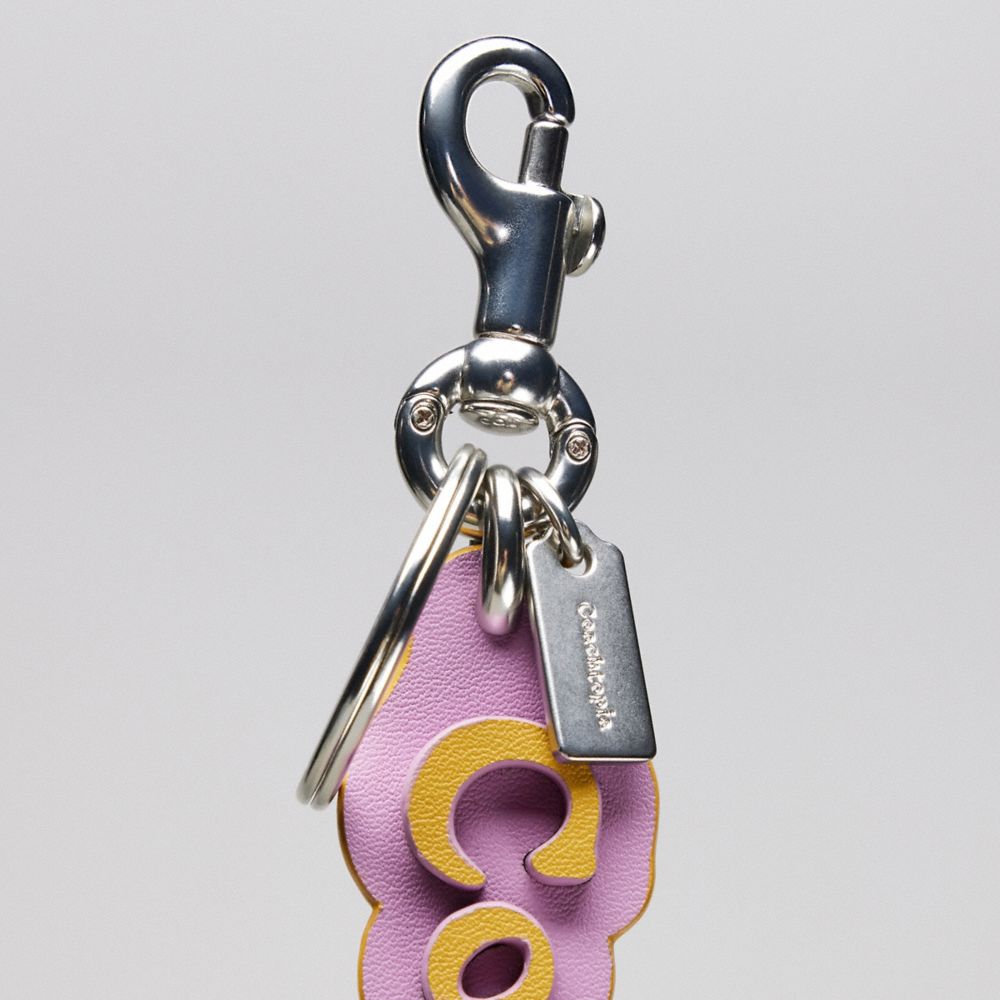 COACH®,Coachtopia Bag Charm In Coachtopia Leather,Coachtopia Leather,Violet Orchid/Flax,Closer View