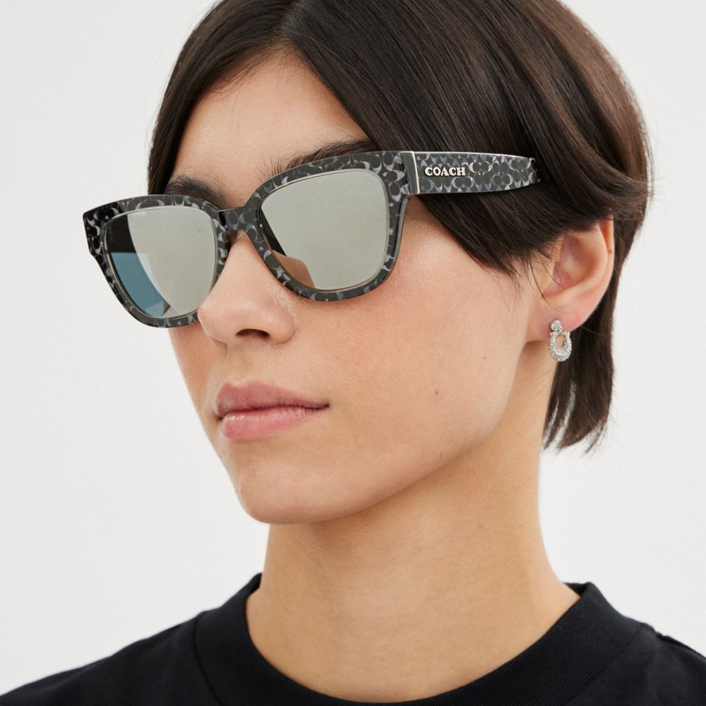 COACH®,SIGNATURE ROUND SUNGLASSES,Silver Pearlized Signature,Angle View