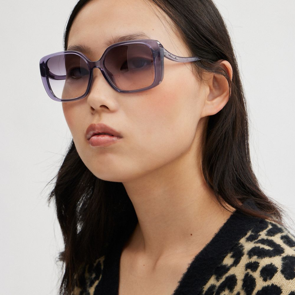 COACH®,SWOOP TEMPLE RECTANGLE SUNGLASSES,Transparent Purple,Angle View