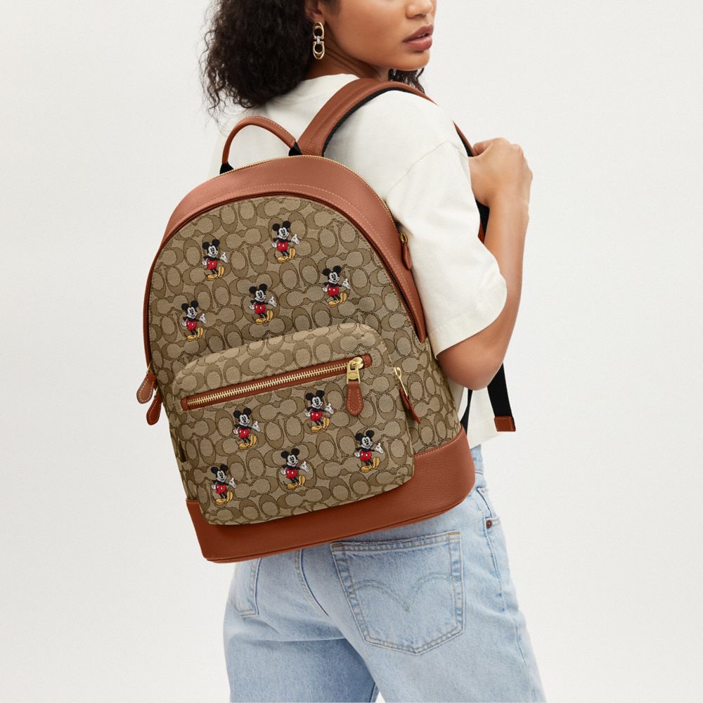 COACH®,Disney X Coach West Backpack In Signature Jacquard With Mickey Mouse Print,,Angle View
