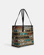 COACH®,COACH X MINT + SERF CITY TOTE BAG IN SIGNATURE CANVAS,Signature Coated Canvas,X-Large,Silver/Khaki Multi,Angle View