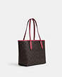 COACH®,MINI CITY TOTE IN SIGNATURE CANVAS WITH HORSE AND SLEIGH,Coated Canvas,Medium,Im/Brown/Rouge,Angle View