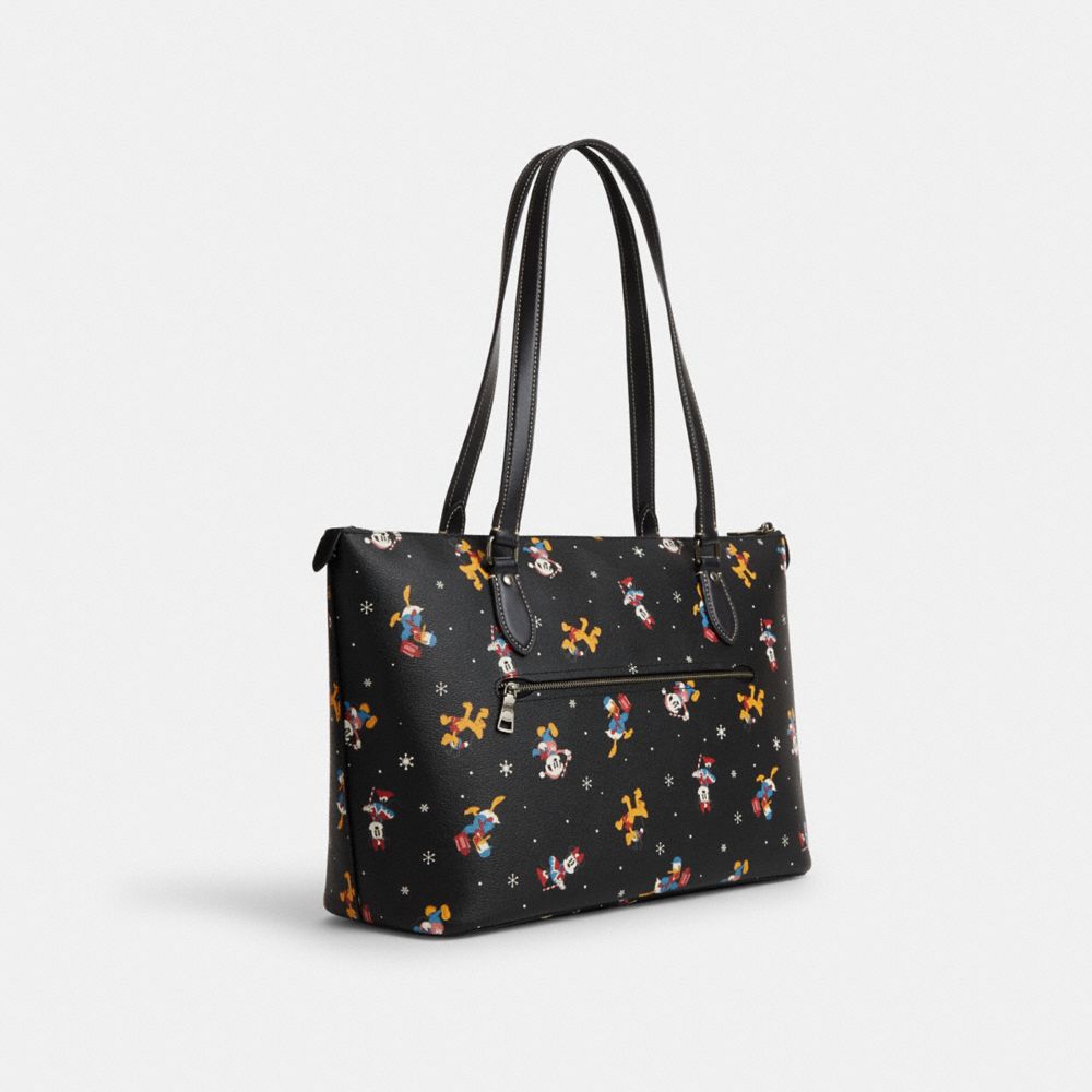 COACH®,DISNEY X COACH GALLERY TOTE BAG WITH HOLIDAY PRINT,Novelty Print,Large,Gunmetal/Black Multi,Angle View