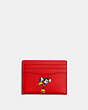 COACH®,DISNEY X COACH SLIM ID CARD CASE WITH WINTER MOTIF,Leather,Black Antique Nickel/Electric Red Multi,Front View