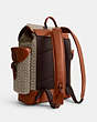 COACH®,HITCH BACKPACK IN MICRO SIGNATURE JACQUARD,Signature Jacquard,Large,Cocoa/Burnished Amber,Angle View