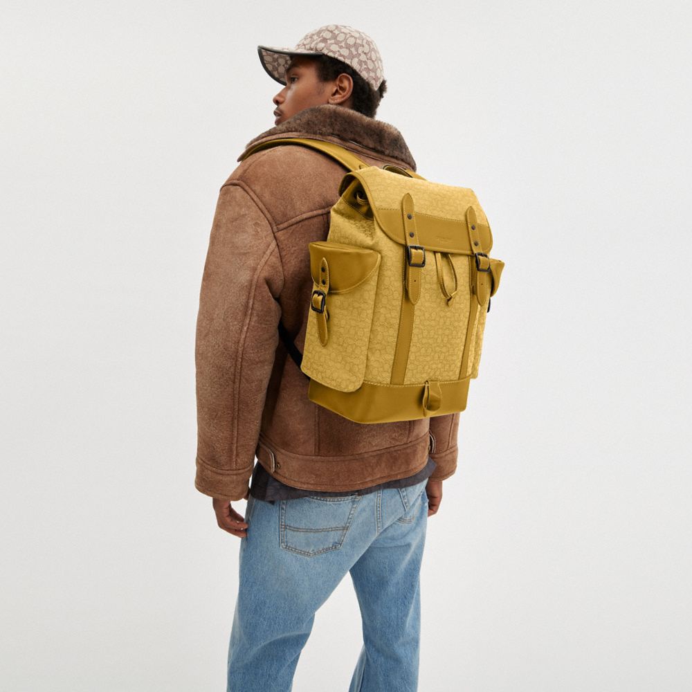 Coach hotsell yellow backpack