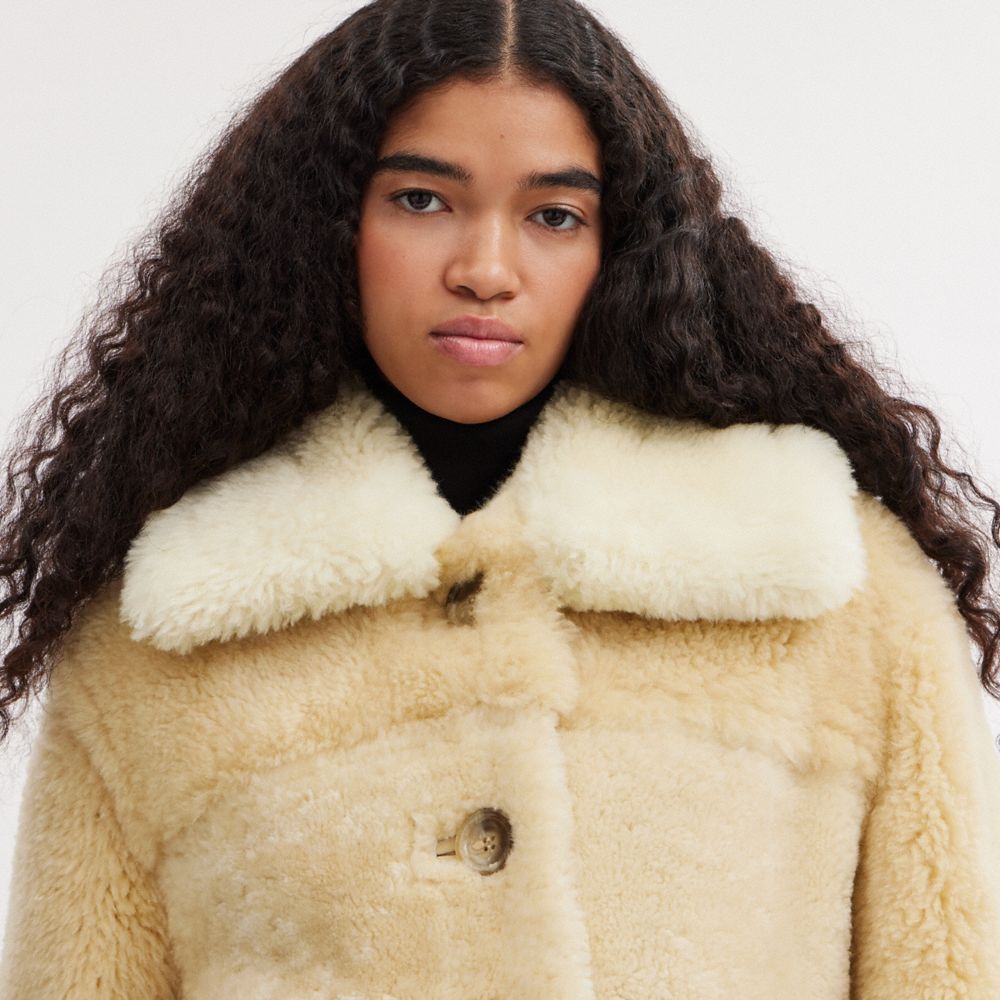 Shearling hotsell coat white