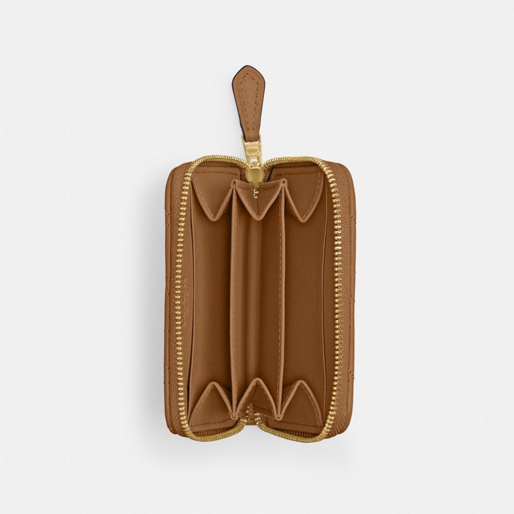 Shop Coach Essential Kleines Kartenetui Mit Rundumreissverschluss Und Bauschiger Steppung In Brass/honey Brown