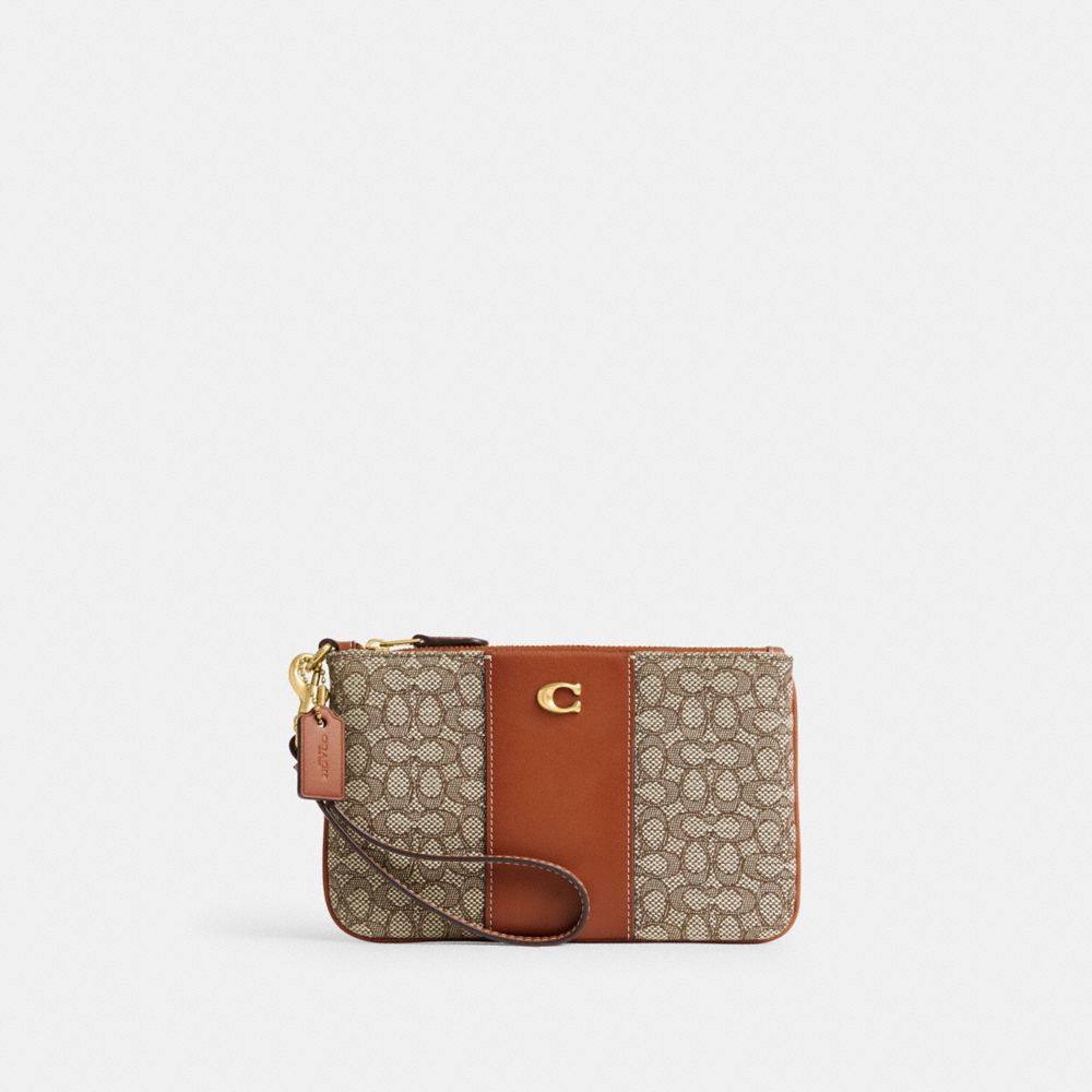COACH®,SMALL WRISTLET IN MICRO SIGNATURE JACQUARD,Signature Jacquard,Mini,Brass/Cocoa Burnished Amb,Front View image number 0