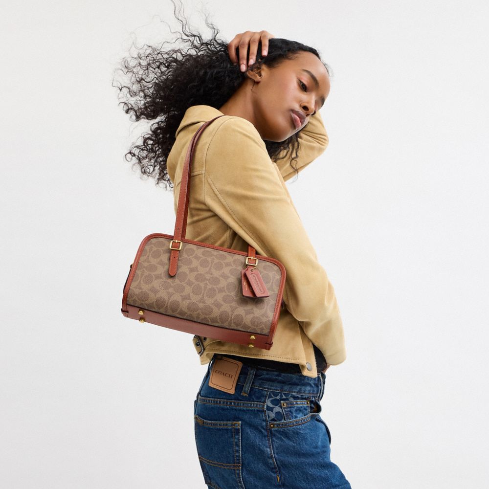 COACH®,Swing Zip Bag In Signature Canvas,,Detail View
