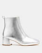 COACH®,NOAH BOOTIE IN SILVER METALLIC,Leather,Silver,Angle View
