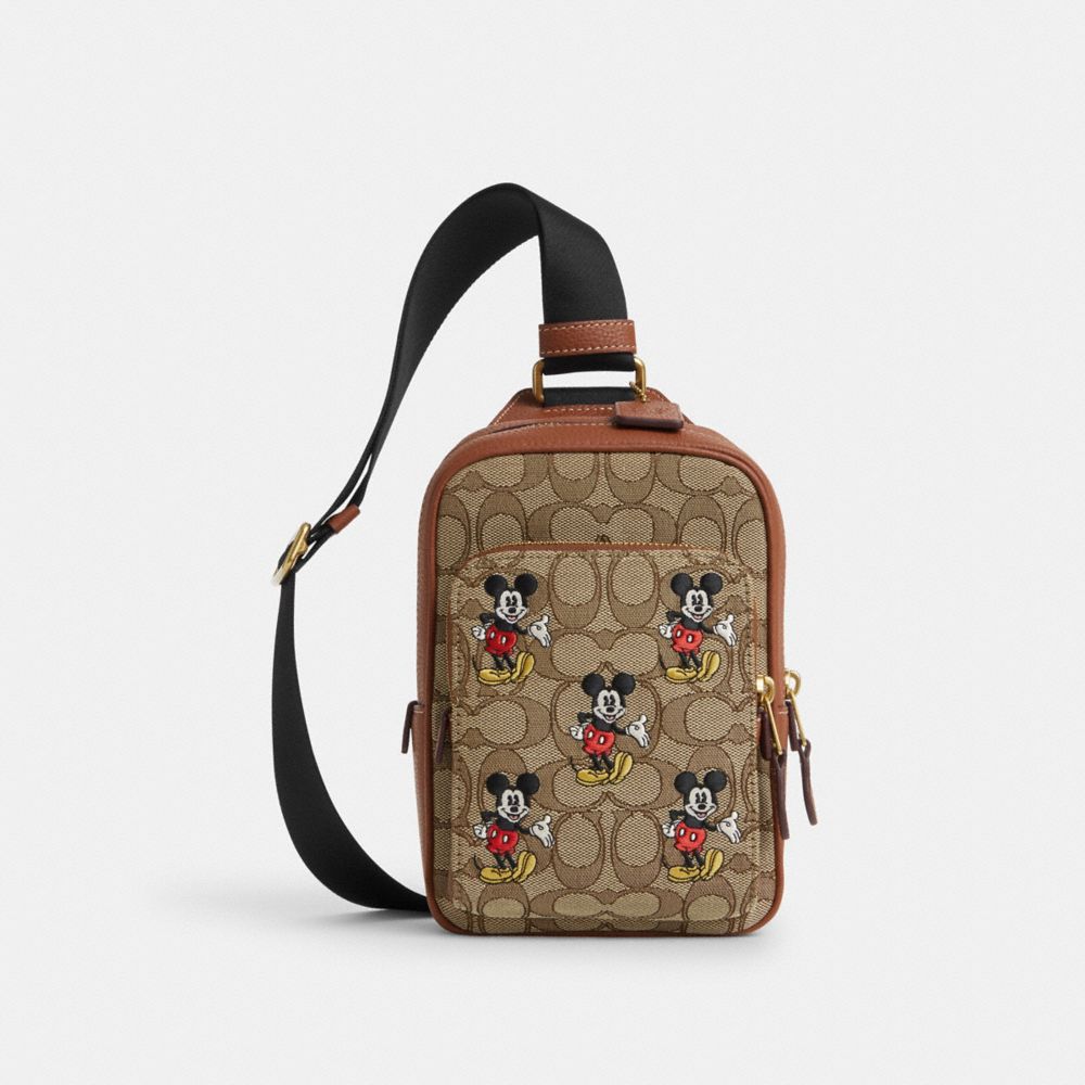 COACH®  Disney X Coach Track Pack 14 In Signature Jacquard With