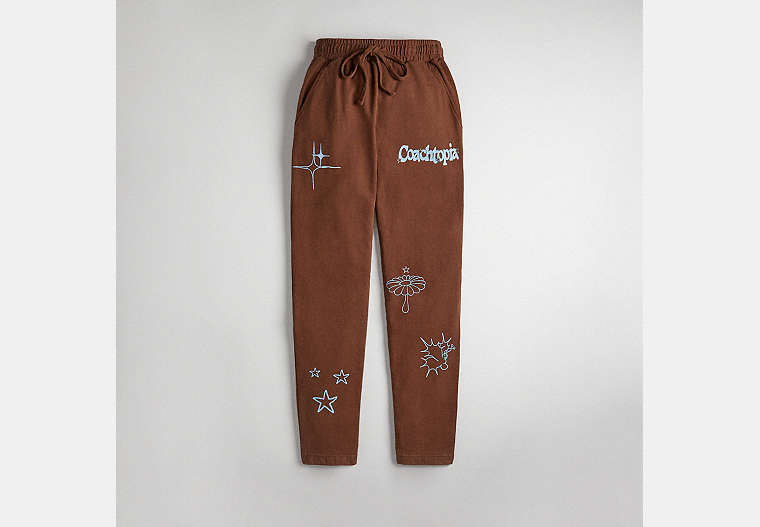 COACH®,Graphic Jogger Pants in 93% Recycled Cotton,93% Recycled Cotton, 4% Recycled Poly, 3% Recycled Viscose,Dark Brown,Front View image number 0