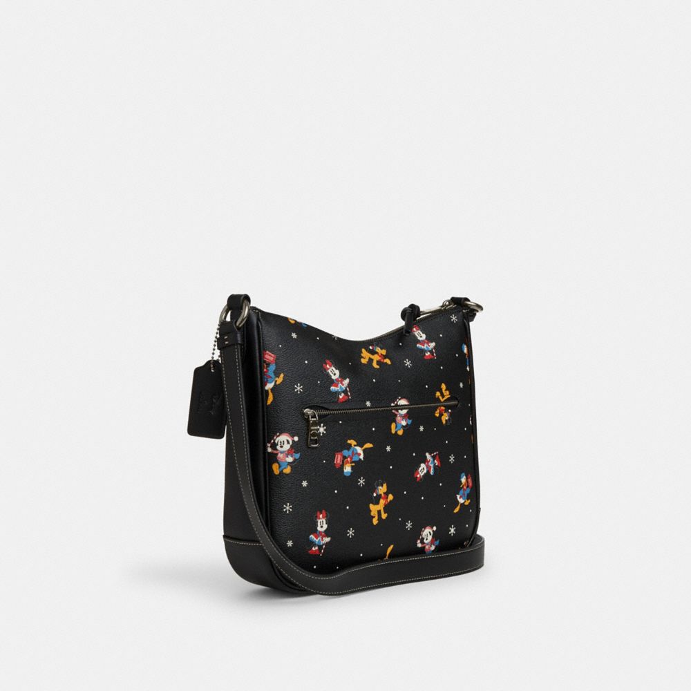 COACH®,DISNEY X COACH ELLIE FILE BAG WITH HOLIDAY PRINT,Novelty Print,Medium,Gunmetal/Black Multi,Angle View