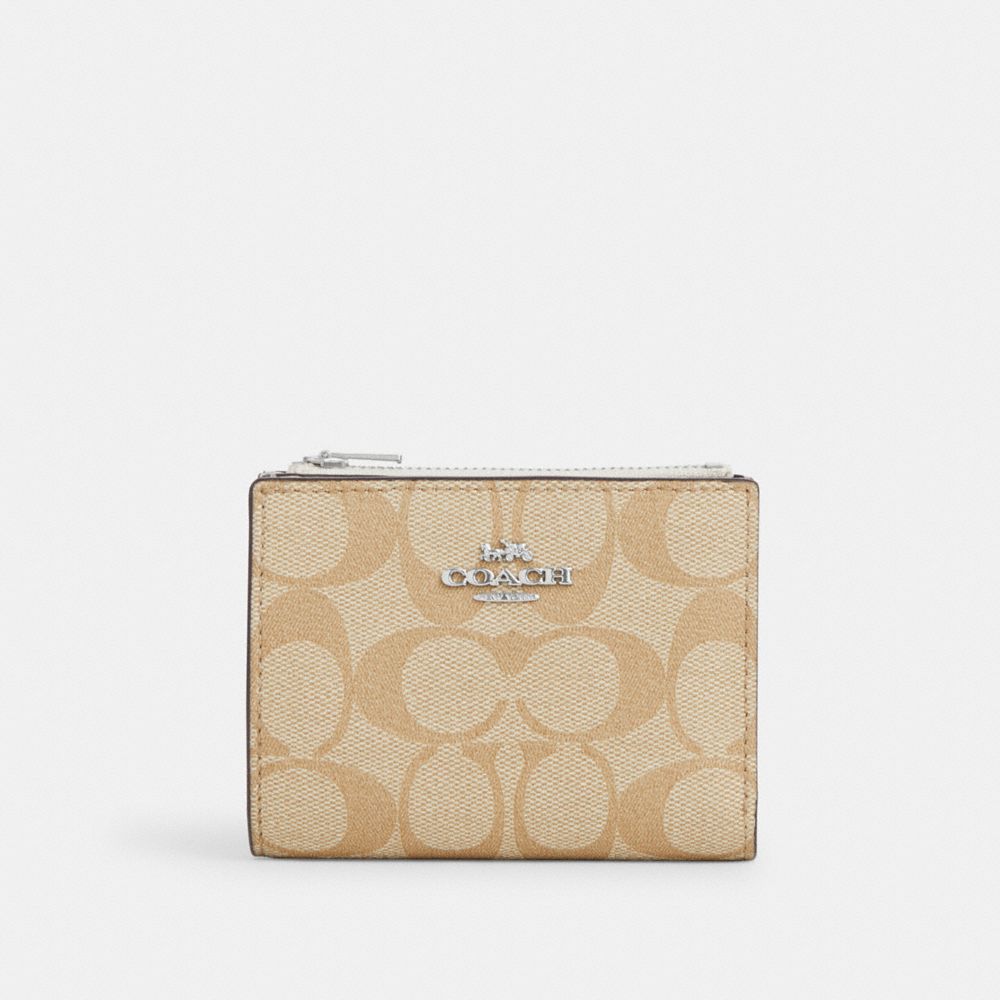 COACH®  Bifold Wallet In Signature Canvas