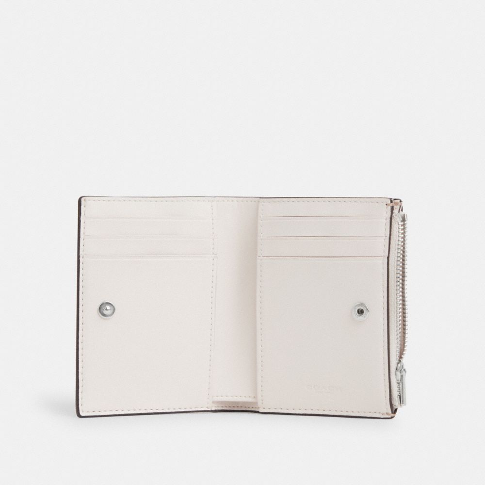 COACH® | Bifold Wallet In Signature Canvas