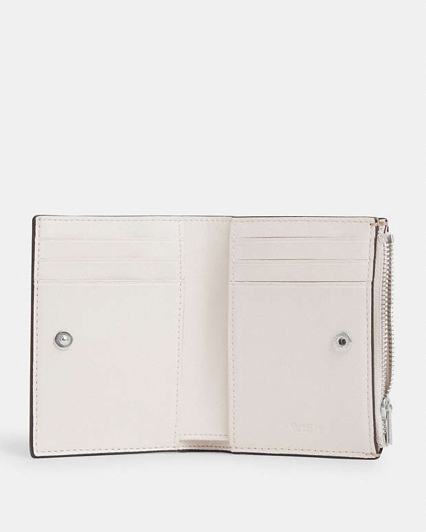 COACH® | Bifold Wallet In Signature Canvas