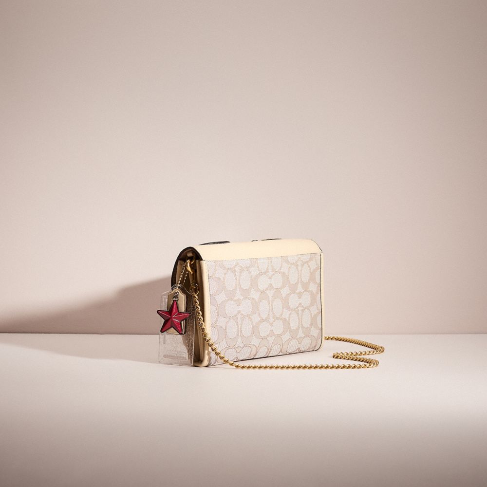 COACH®,UPCRAFTED TABBY CHAIN CLUTCH IN SIGNATURE JACQUARD,Brass/Stone Ivory,Angle View
