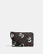 COACH®,CORNER ZIP WRISTLET IN SIGNATURE CANVAS WITH HALLOWEEN EYES,pvc,Mini,Silver/Brown Black Multi,Front View