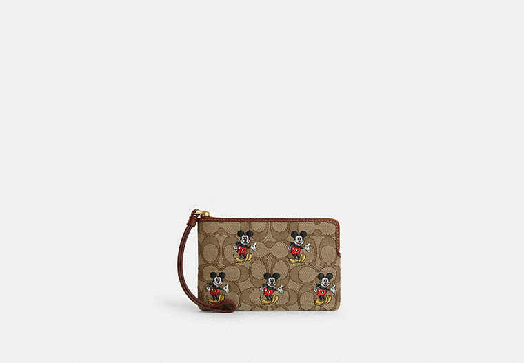 COACH®,DISNEY X COACH CORNER ZIP WRISTLET IN SIGNATURE JACQUARD WITH MICKEY MOUSE PRINT,Jacquard,Brass/Khaki/Redwood Multi,Front View image number 0