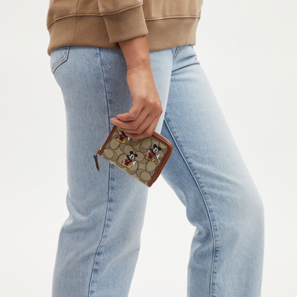 Coach Outlet Disney X Small Zip Around Wallet In Signature Jacquard With Mickey Mouse Print - Women's Wallets - multi