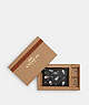 COACH®,BOXED CORNER ZIP WRISTLET IN SIGNATURE CANVAS WITH SNOWMAN PRINT,Coated Canvas,Mini,Silver/Graphite/Black Multi,Front View