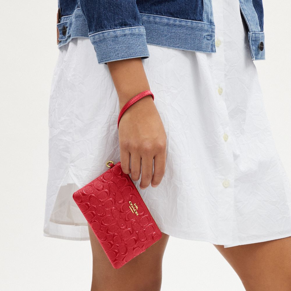 COACH®,BOXED CORNER ZIP WRISTLET IN SIGNATURE LEATHER,Embossed Leather,Mini,Gold/Electric Red,Detail View