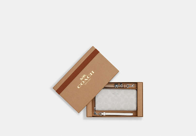COACH®,BOXED LONG ZIP AROUND WALLET IN SIGNATURE CANVAS,Coated Canvas,Mini,Silver/Chalk/Glacier White Multi,Front View