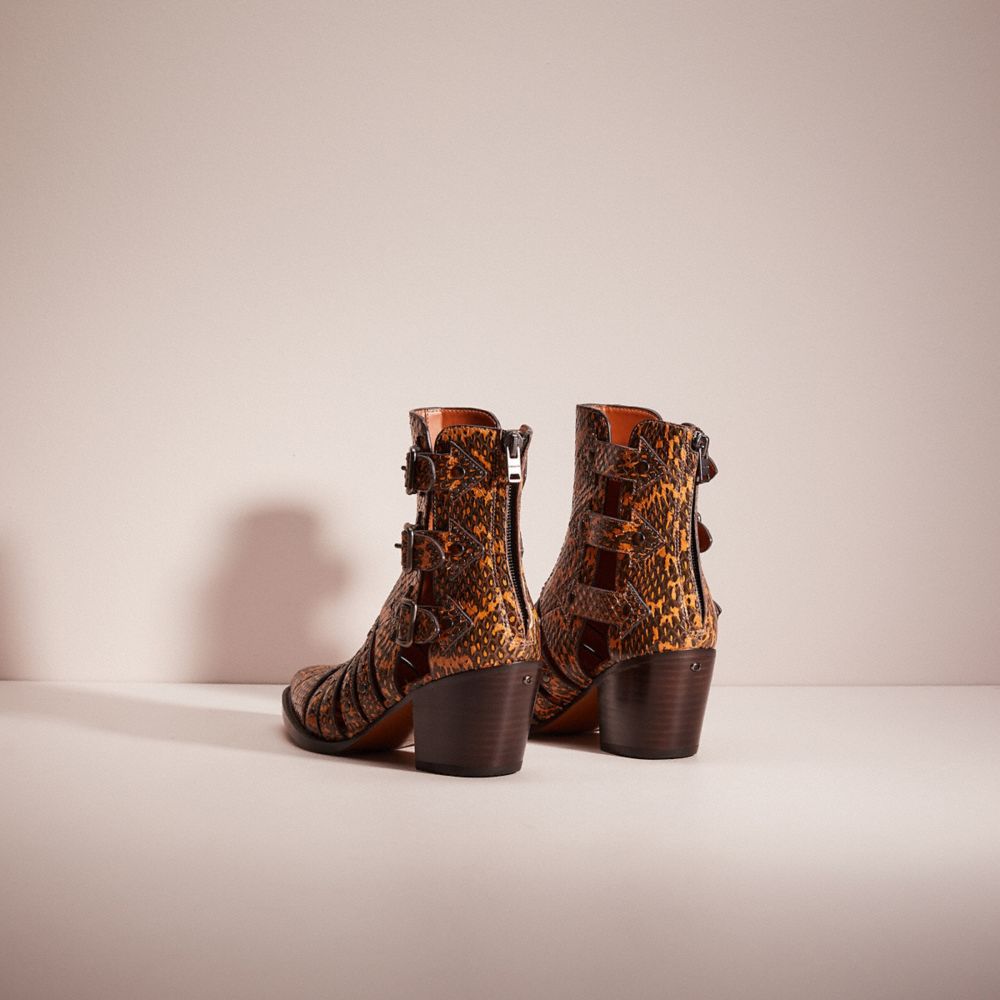 Coach shop snakeskin boots