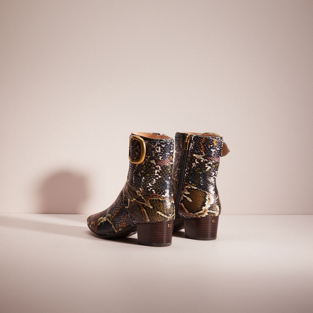 Coach best sale snakeskin boots