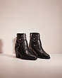 COACH®,RESTORED PIA WESTERN BOOTIE,Leather,Black,Angle View