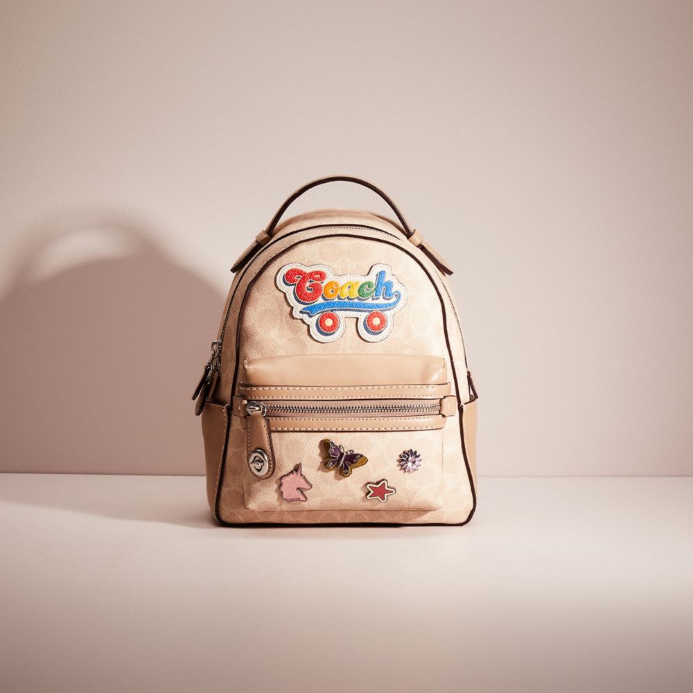 Disney x coach campus backpack 23 in signature patchwork hotsell