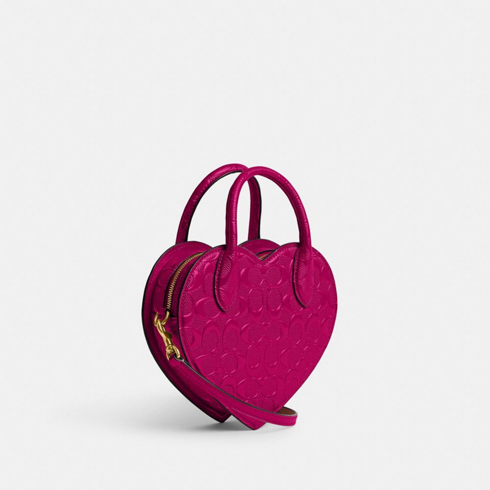 COACH®,HEART BAG IN SIGNATURE LEATHER,Small,Brass/Magenta,Angle View