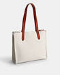 COACH®,COSMIC COACH RELAY TOTE 34 WITH REXY,Polished Pebble Leather,Chalk Multi,Angle View