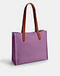 COACH®,COSMIC COACH RELAY TOTE 34 WITH ROCKET,Polished Pebble Leather,Violet Orchid Multi,Angle View