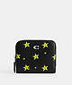 COACH®,COSMIC COACH BILLFOLD WALLET WITH STAR PRINT,Polished Pebble Leather,Mini,Silver/Black,Front View