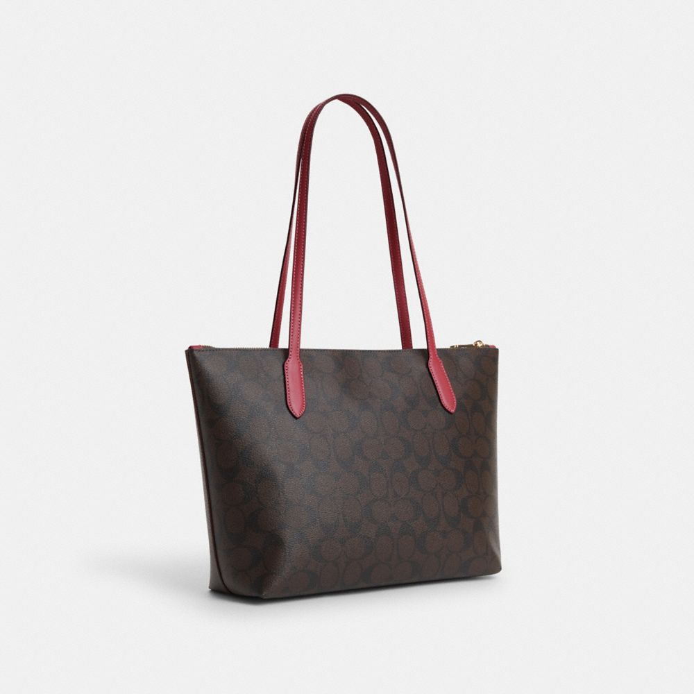 COACH®,ZIP TOP TOTE BAG IN SIGNATURE CANVAS WITH HORSE AND SLEIGH,Signature Canvas,Medium,Im/Brown/Rouge,Angle View