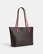 COACH®,ZIP TOP TOTE IN SIGNATURE CANVAS WITH HORSE AND SLEIGH,Coated Canvas,Large,Im/Brown/Rouge,Angle View