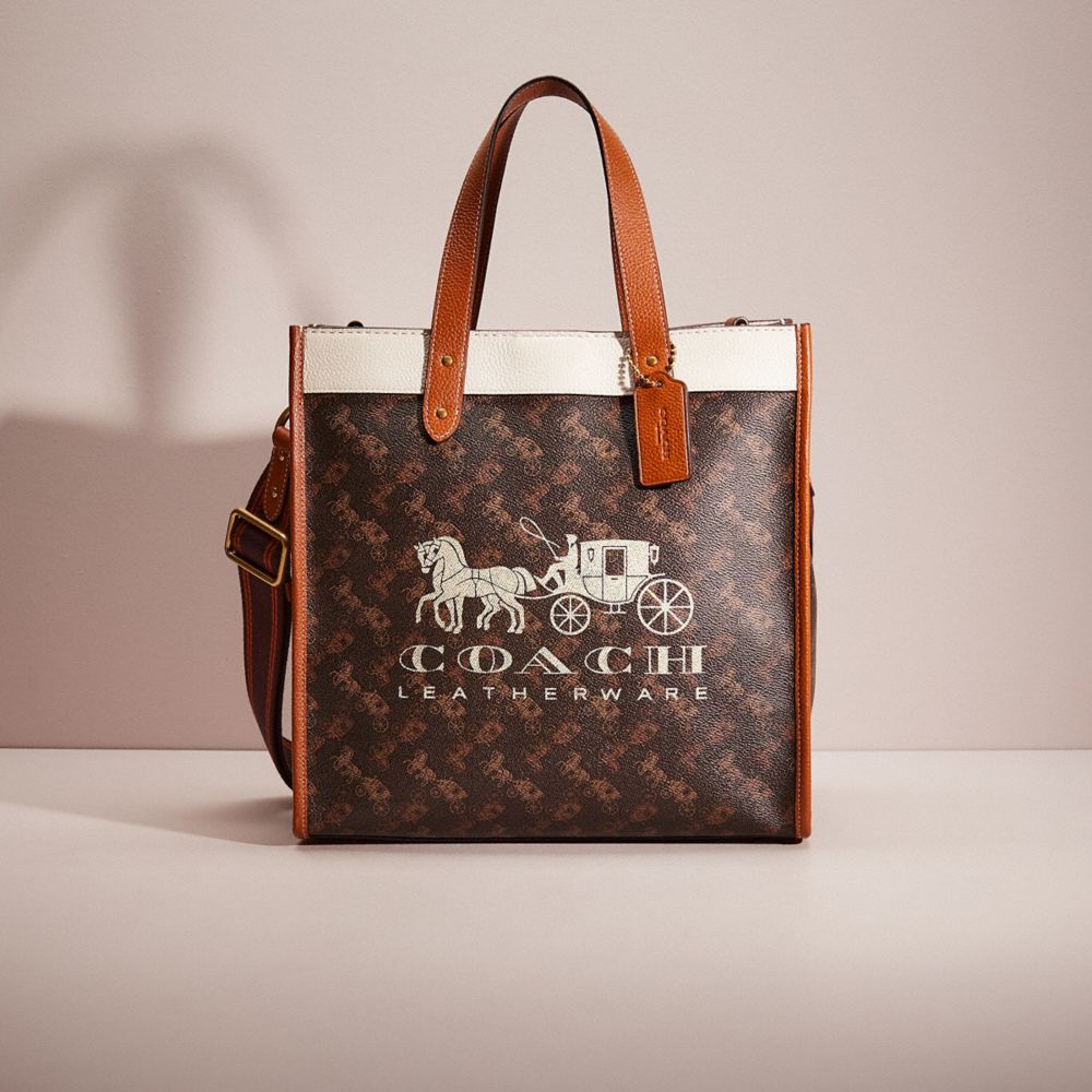 COACH®,RESTORED FIELD TOTE WITH HORSE AND CARRIAGE PRINT AND CARRIAGE BADGE,Brass/Truffle Burnished Amber,Front View