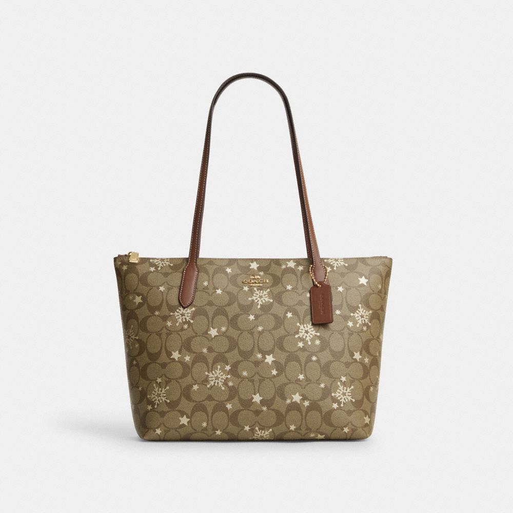 COACH®,ZIP TOP TOTE BAG IN SIGNATURE CANVAS WITH STAR AND SNOWFLAKE PRINT,Signature Canvas,Medium,Im/Khaki Saddle/Gold Multi,Front View